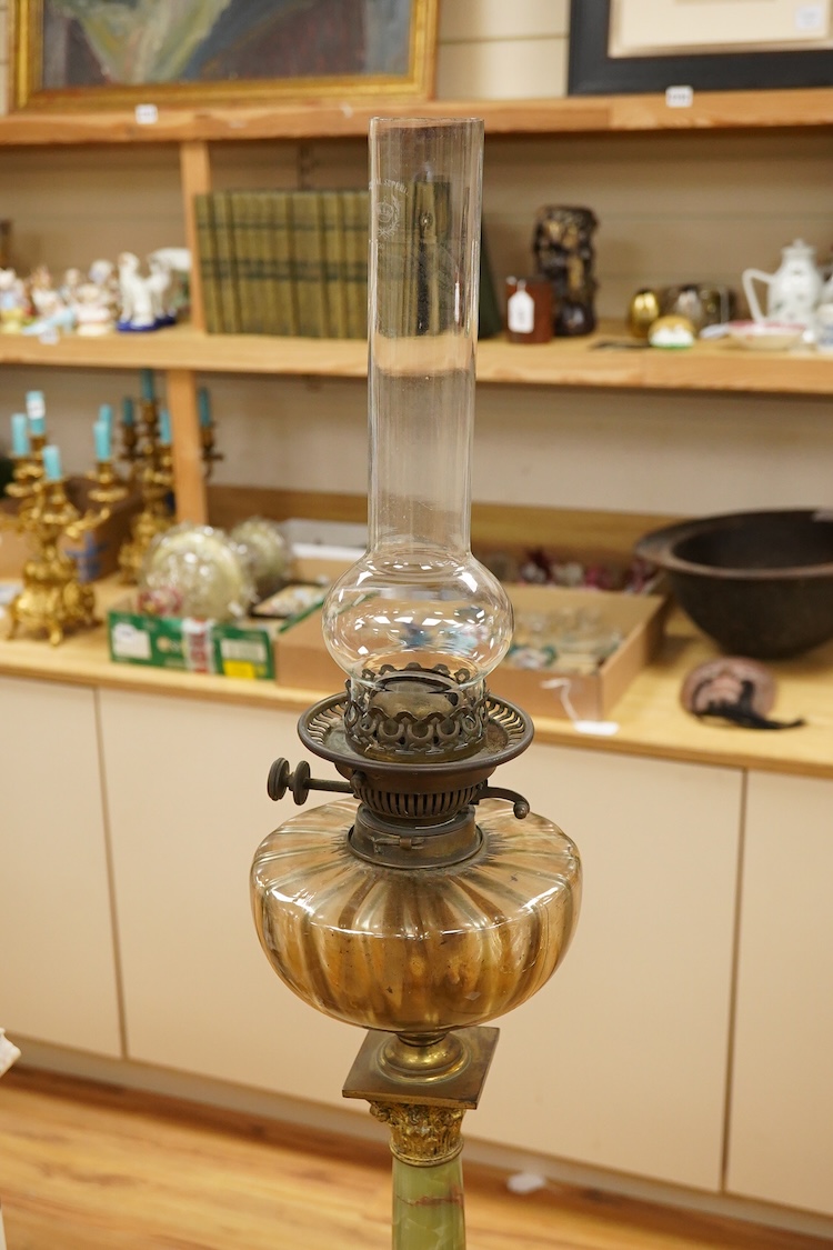An onyx oil lamp with glass reservoir, 82cm high